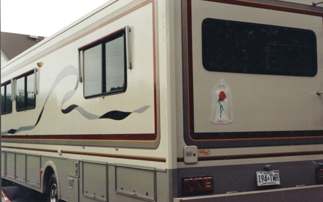 Motorhome decorated with vinyl striping and painted artwork.