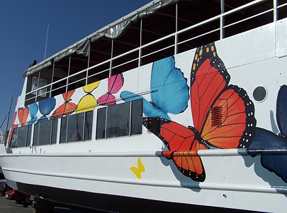 Large handpainted artwork over the freshly painted boat.